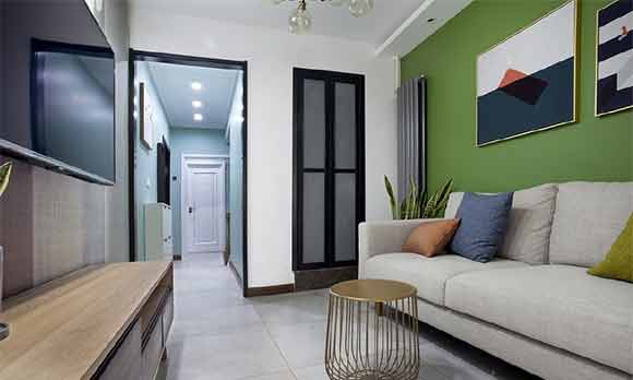 紧凑的一居室空间,绿色沙发背景墙特别醒目,有品位的简约风格装修!